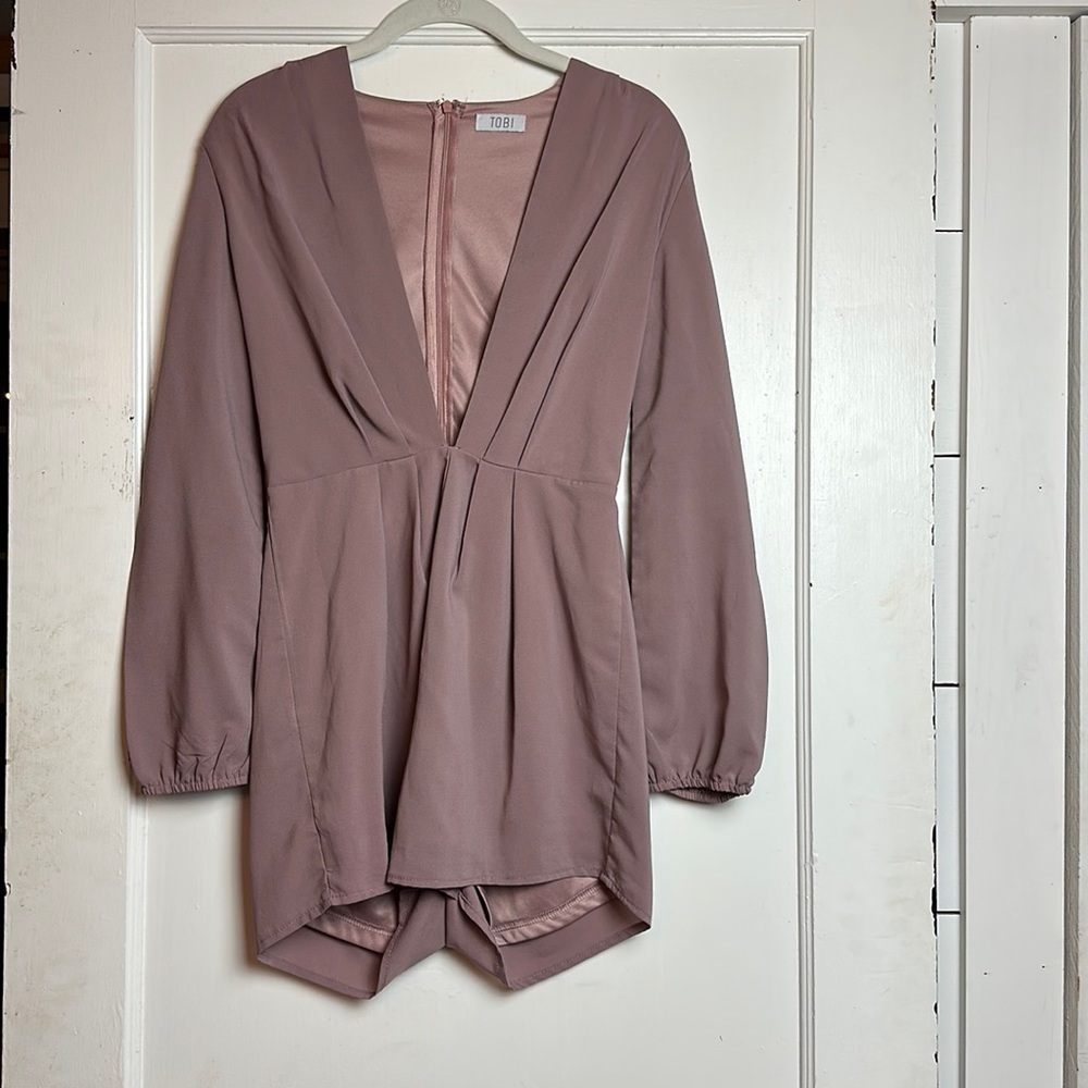 Tobi romper with a deep v in the front.